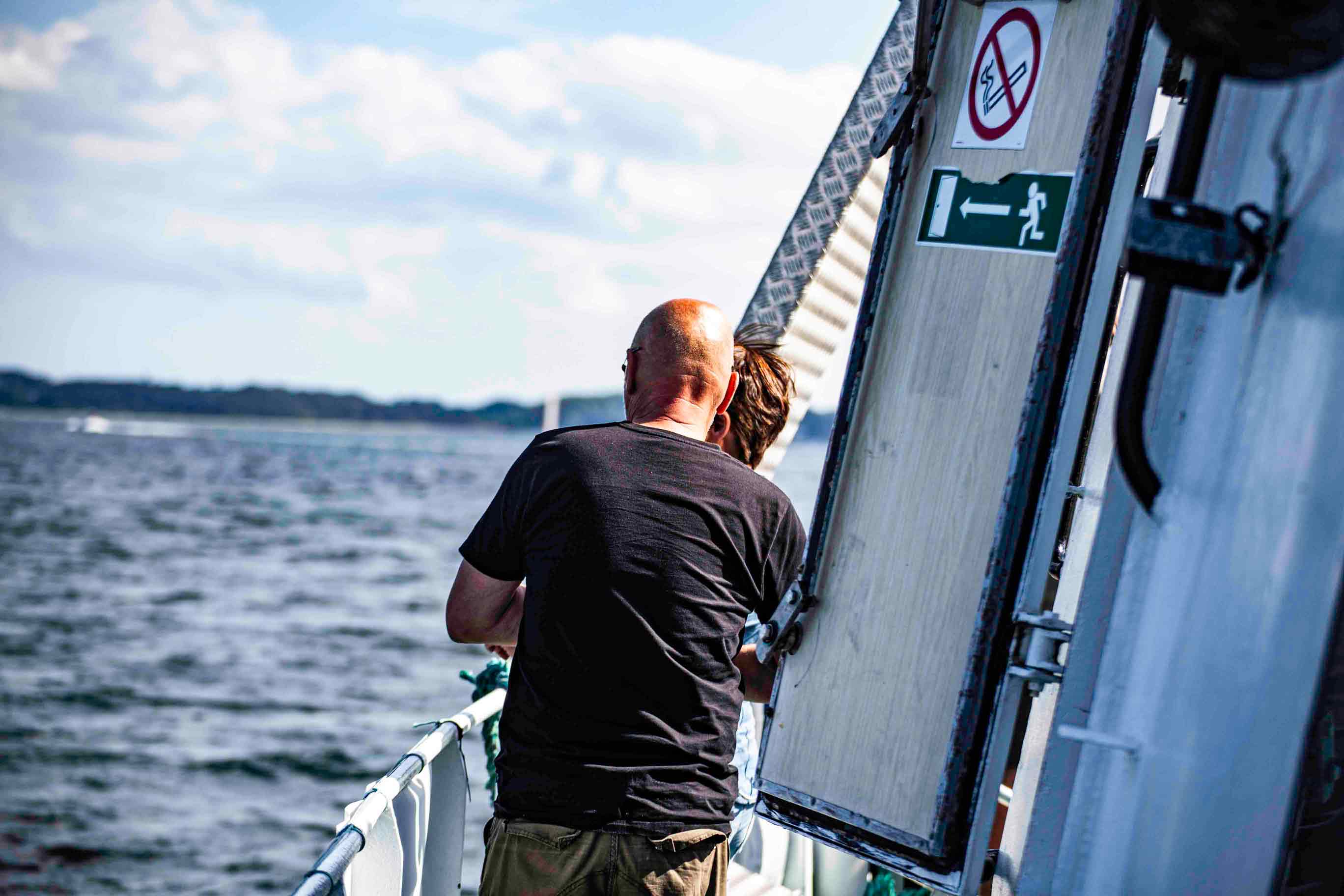 Happy people enjoying a ferry ride